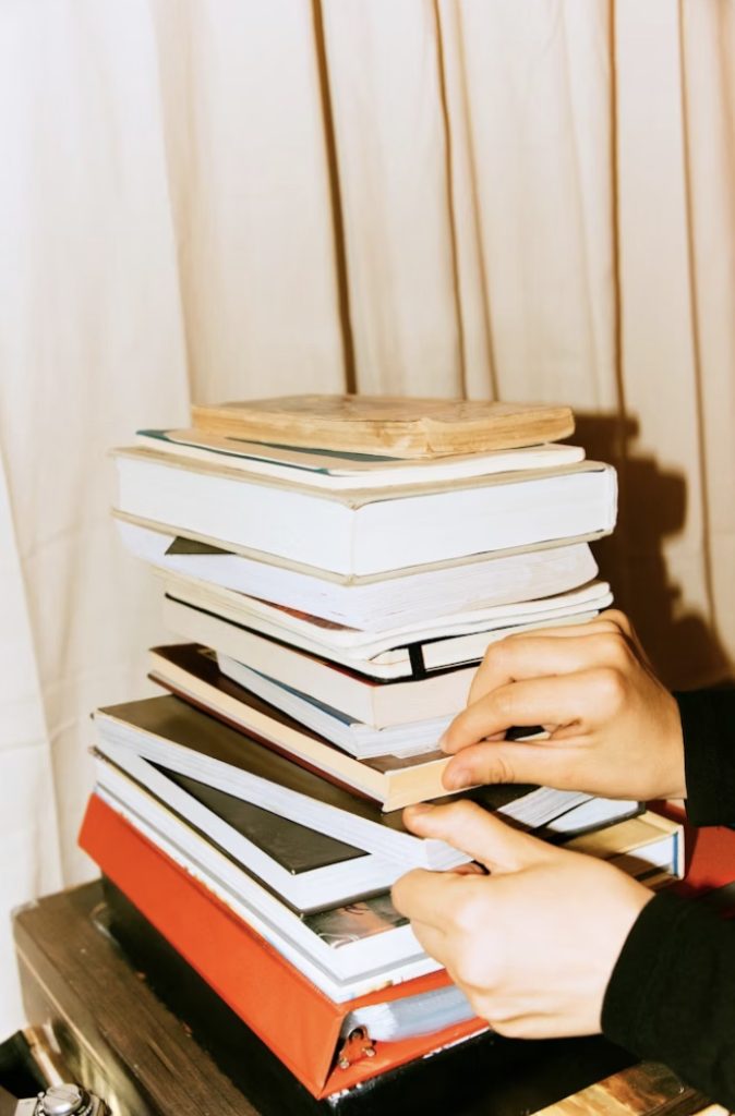A pile of books, representing dissertation research and writing.